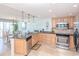 Open concept kitchen with stainless appliances and adjacent dining area at 9820 Queensway Blvd. # 1210, Myrtle Beach, SC 29572