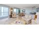 Bright living area with tile flooring and seamless access to the dining area and balcony at 9820 Queensway Blvd. # 1210, Myrtle Beach, SC 29572