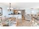 Inviting living space featuring tiled floors, bar seating, and comfortable furniture at 9820 Queensway Blvd. # 1210, Myrtle Beach, SC 29572