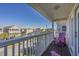 Relaxing balcony view with two chairs overlooking the neighborhood and coastline in the distance at 113B 15Th Ave. S, Surfside Beach, SC 29575