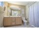 Bathroom with a double sink vanity, neutral tiling, and a shower-tub combination at 113B 15Th Ave. S, Surfside Beach, SC 29575