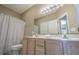 Bathroom with a double vanity, ample lighting, and a shower-tub combination at 113B 15Th Ave. S, Surfside Beach, SC 29575