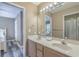 Bright bathroom featuring double sink vanity and large mirror at 113B 15Th Ave. S, Surfside Beach, SC 29575