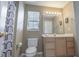 Well-lit bathroom featuring a single sink vanity and framed mirror at 113B 15Th Ave. S, Surfside Beach, SC 29575