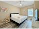 Bright bedroom featuring a comfortable bed, light wood floors, and stylish decor at 113B 15Th Ave. S, Surfside Beach, SC 29575