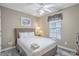 Inviting bedroom with a queen bed, natural lighting and wood floors at 113B 15Th Ave. S, Surfside Beach, SC 29575