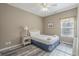 Cozy bedroom with a queen bed, wood floors and a bright window at 113B 15Th Ave. S, Surfside Beach, SC 29575