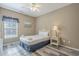 Charming bedroom with a queen bed, bright window and wood floors at 113B 15Th Ave. S, Surfside Beach, SC 29575