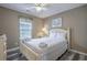 Neutral bedroom featuring a queen bed, wood floors and natural lighting at 113B 15Th Ave. S, Surfside Beach, SC 29575