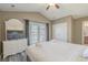 Light-filled bedroom with vaulted ceiling, balcony access, tv, and neutral decor at 113B 15Th Ave. S, Surfside Beach, SC 29575