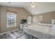 Spacious bedroom with two beds, bright windows, vaulted ceiling, and light wood floors at 113B 15Th Ave. S, Surfside Beach, SC 29575