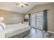Comfortable bedroom with access to a private balcony, vaulted ceiling and warm neutral decor at 113B 15Th Ave. S, Surfside Beach, SC 29575