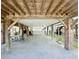 Spacious carport under the elevated home with brick supports, providing ample parking at 113B 15Th Ave. S, Surfside Beach, SC 29575