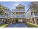 Inviting three-story beach house with multiple balconies, street view and ample parking at 113B 15Th Ave. S, Surfside Beach, SC 29575