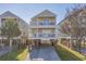 Charming three-story beach house with multiple balconies and street view at 113B 15Th Ave. S, Surfside Beach, SC 29575