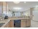 Open-concept kitchen with breakfast bar overlooking the living area, creating a seamless flow for entertaining at 113B 15Th Ave. S, Surfside Beach, SC 29575