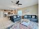 Comfortable living room area with two sofas, a patterned rug, and an open view into the kitchen and dining space at 113B 15Th Ave. S, Surfside Beach, SC 29575