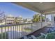Expansive porch view with palm trees and relaxing chairs at 113B 15Th Ave. S, Surfside Beach, SC 29575