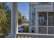 Relaxing porch view with palm trees, street and homes in the background at 113B 15Th Ave. S, Surfside Beach, SC 29575