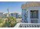 Relaxing balcony view showcasing neighborhood charm and glimpses of the ocean, perfect for unwinding at 113B 15Th Ave. S, Surfside Beach, SC 29575