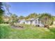 Well-maintained backyard with lush green grass, mature trees, and privacy landscaping, creating a serene outdoor space at 1161 Ganton Way, Myrtle Beach, SC 29588