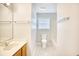 Bright bathroom featuring a single sink vanity and a window above the toilet and bath at 1161 Ganton Way, Myrtle Beach, SC 29588