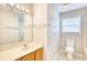 Bright bathroom featuring a single sink vanity with a window above the toilet and bath at 1161 Ganton Way, Myrtle Beach, SC 29588