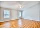 Bright bedroom with hardwood floors, ceiling fan, and two windows providing natural light at 1161 Ganton Way, Myrtle Beach, SC 29588