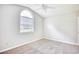 Cozy bedroom with neutral carpet, ceiling fan, and large window at 1161 Ganton Way, Myrtle Beach, SC 29588