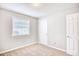 A bright bedroom with carpeted floors and neutral walls features a window and door at 1161 Ganton Way, Myrtle Beach, SC 29588
