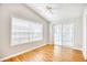A bright room featuring a ceiling fan, large window, and sliding glass doors leading to an enclosed porch at 1161 Ganton Way, Myrtle Beach, SC 29588