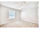 A bright bedroom with carpeted floors and neutral walls features a ceiling fan at 1161 Ganton Way, Myrtle Beach, SC 29588