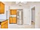 Well-lit kitchen featuring stainless steel refrigerator and ample cabinet space at 1161 Ganton Way, Myrtle Beach, SC 29588
