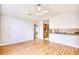 Open floorplan view from the living room into the kitchen, featuring wood-look flooring and light walls at 1161 Ganton Way, Myrtle Beach, SC 29588