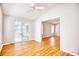 Sun-drenched room with wood-look flooring that connects to a sunroom and other areas of the house at 1161 Ganton Way, Myrtle Beach, SC 29588