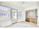 Bright sunroom with multiple windows, a ceiling fan, and a sliding glass door leading to the outside at 1161 Ganton Way, Myrtle Beach, SC 29588