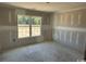 Bedroom with a large window allowing plenty of natural light to fill the space of this home under construction at 1280 Highway 45, Loris, SC 29569