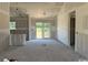 Spacious living room under construction with sliding glass doors leading to the yard at 1284 Highway 45, Loris, SC 29569