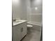 Bathroom featuring a shower tub combination and single sink vanity at 191 Glengrove Lane, Murrells Inlet, SC 29576