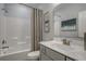 Bathroom features a shower tub combination, decorative curtain, and single sink vanity at 191 Glengrove Lane, Murrells Inlet, SC 29576
