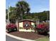 International Club entrance sign surrounded by colorful flowers, trees and green grass at 191 Glengrove Lane, Murrells Inlet, SC 29576