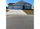 Charming single-Gathering home featuring an attached two-car garage and well-maintained lawn at 191 Glengrove Lane, Murrells Inlet, SC 29576