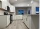 Modern kitchen with white cabinets, granite countertops, and stainless steel appliances at 191 Glengrove Lane, Murrells Inlet, SC 29576