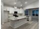 Bright kitchen featuring stainless steel appliances, granite countertops, island, and pendant lights at 191 Glengrove Lane, Murrells Inlet, SC 29576