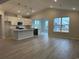 Open concept living area featuring a kitchen with granite countertops and stainless appliances at 191 Glengrove Lane, Murrells Inlet, SC 29576