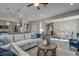 Spacious open-concept living area with adjacent kitchen, dining area, and large windows, featuring luxury vinyl flooring at 191 Glengrove Lane, Murrells Inlet, SC 29576