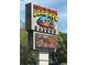 Dead Dog Saloon sign featuring food and beverage options for happy hour at 191 Glengrove Lane, Murrells Inlet, SC 29576