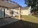 Backyard patio featuring a pergola, view of house and air conditioning unit at 445 Saint Charles Circle, Myrtle Beach, SC 29588