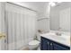 Bathroom featuring a shower-tub combo and blue vanity at 445 Saint Charles Circle, Myrtle Beach, SC 29588