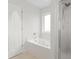 Bathroom with a soaking tub and shower at 445 Saint Charles Circle, Myrtle Beach, SC 29588